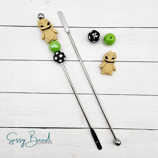 Close-up of Halloween-themed silicone beads in Halloween designs for DIY stir stick making