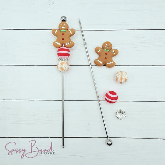 Close-up of Christmas-themed silicone beads in Gingerbread and stripe bead designs for DIY cookie scribe making