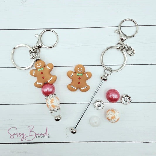 Close-up of Christmas-themed silicone beads in Gingerbread and stripe bead designs for DIY keychain making