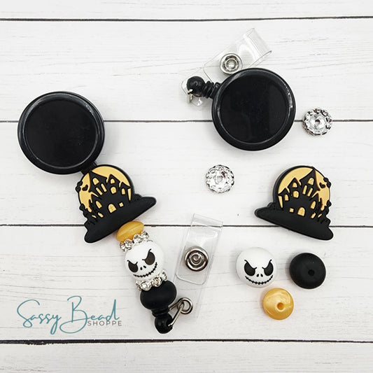 Close-up of Halloween-themed silicone beads in Haunted House with scary designs for DIY badge reel making