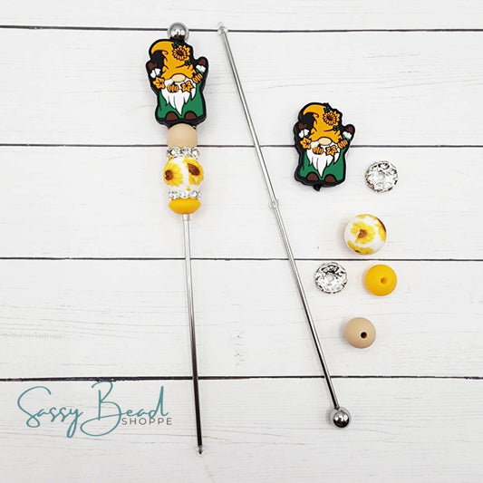 Close-up of Thanksgiving-themed silicone beads with Autumn gnome for DIY cookie scribe making