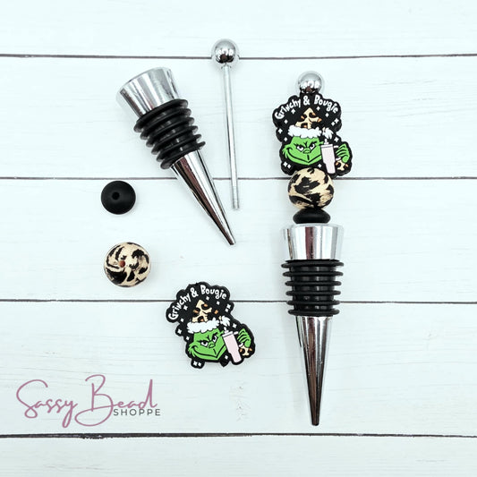 Close-up of Christmas-themed silicone beads in Christmas designs for DIY wine stopper making