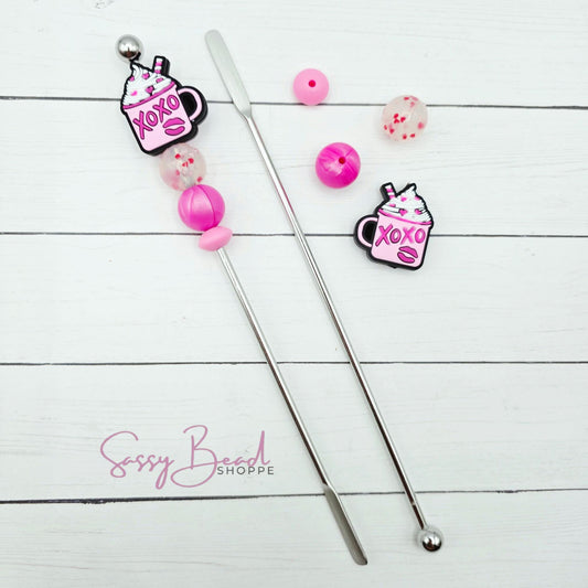 Close-up of Valentine-themed silicone beads in Coffee Mug designs for DIY stir stick making