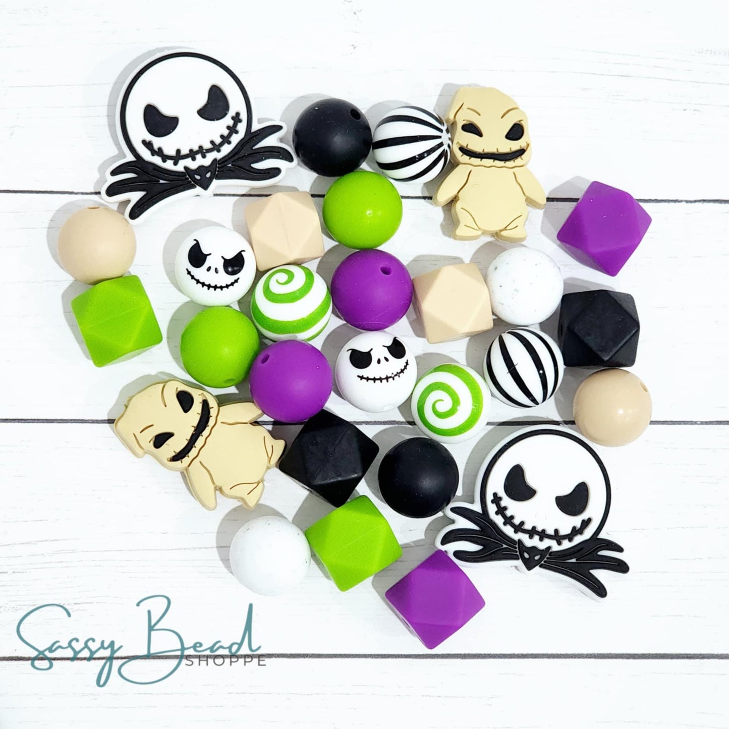 Moon Shadow Silicone bead mix styled flat lay showing beads for beaded pens, including seasonal Jack, Creepy Cute Bug Monster designs