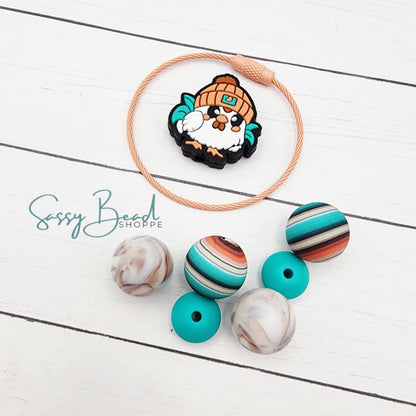 Close-up of Thanksgiving-themed silicone beads with turkey for DIY cup charm making