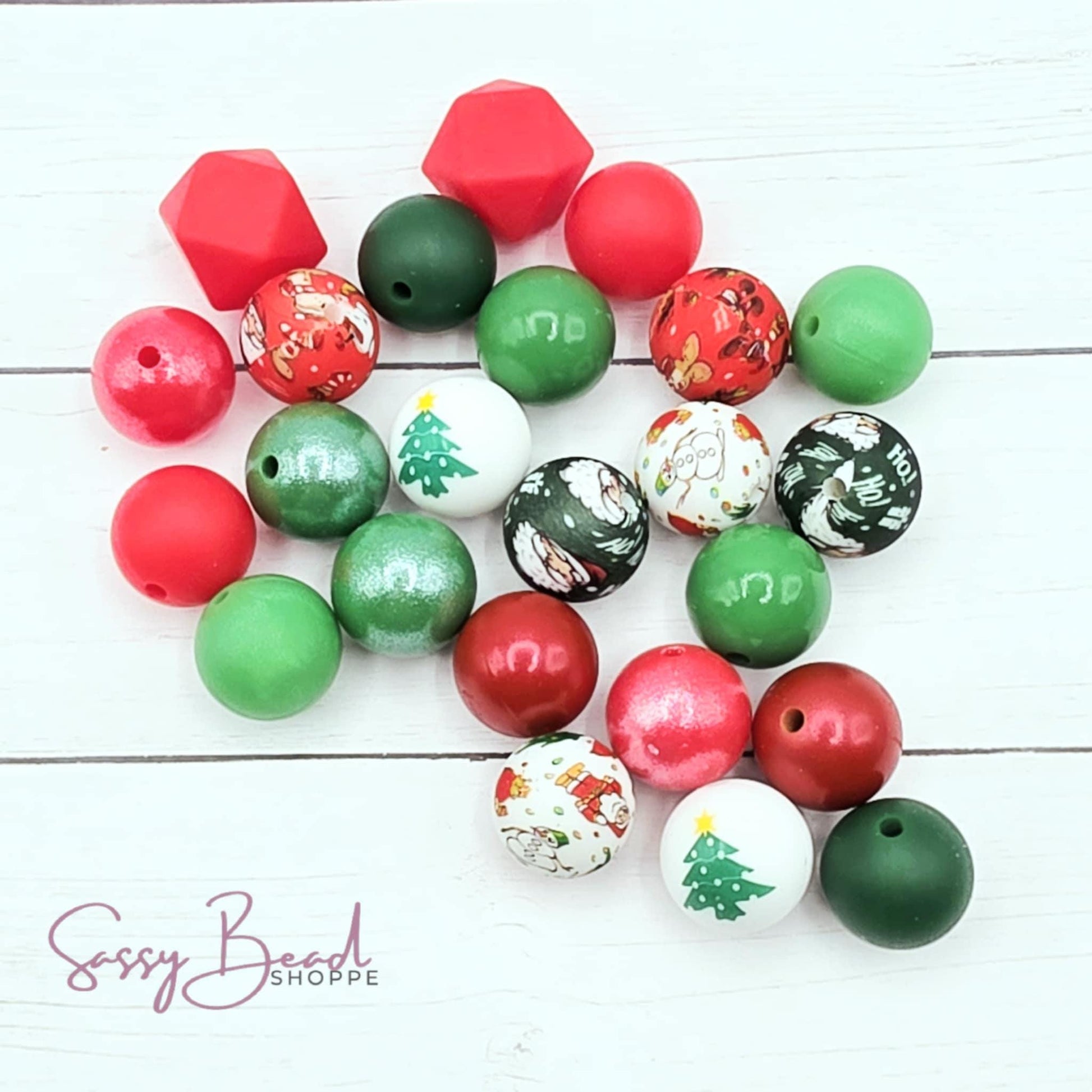 Close-up of Christmas-themed silicone beads in Santa, Snowman, Trees and Christmas designs for DIY pens, badge reels, wristlets, cookie scribes, and all your jewelry making