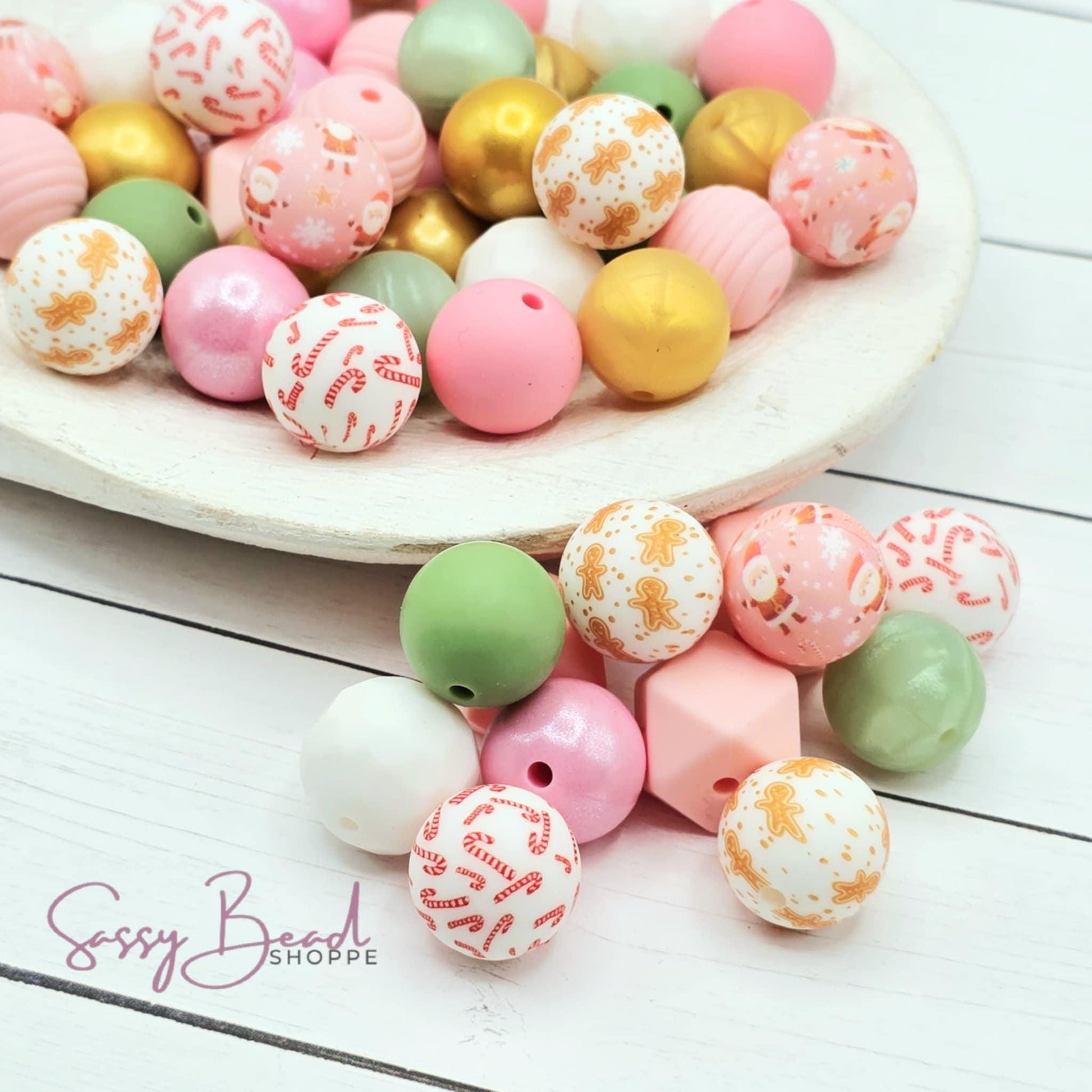 Frosted Cheer Bead Mix with a fun mix of Christmas beads - Pink Santa, Candy Cane, and Gingerbread Man beads — plus accent beads