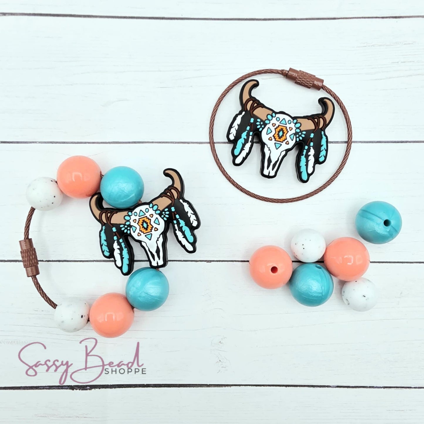 Close-up of Western-themed silicone beads in skull designs for making your tumbler charm. Completed charm is for reference only.