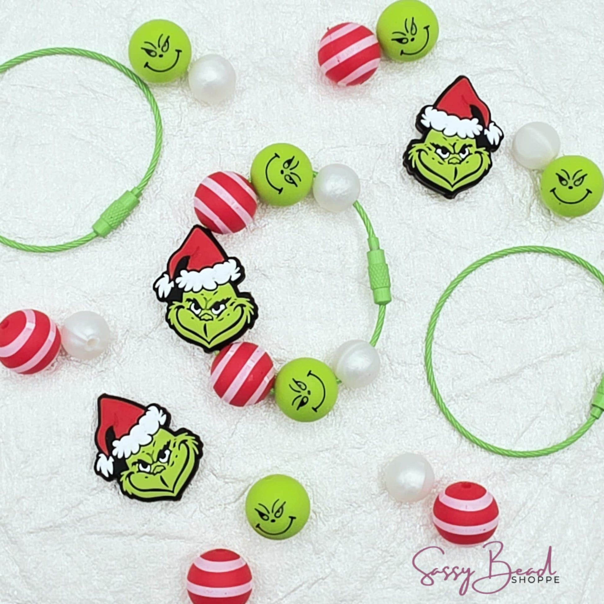 Christmas Grump tumbler charm with a fun mix of Christmas beads - green guy, red & white stripes  — plus accent beads