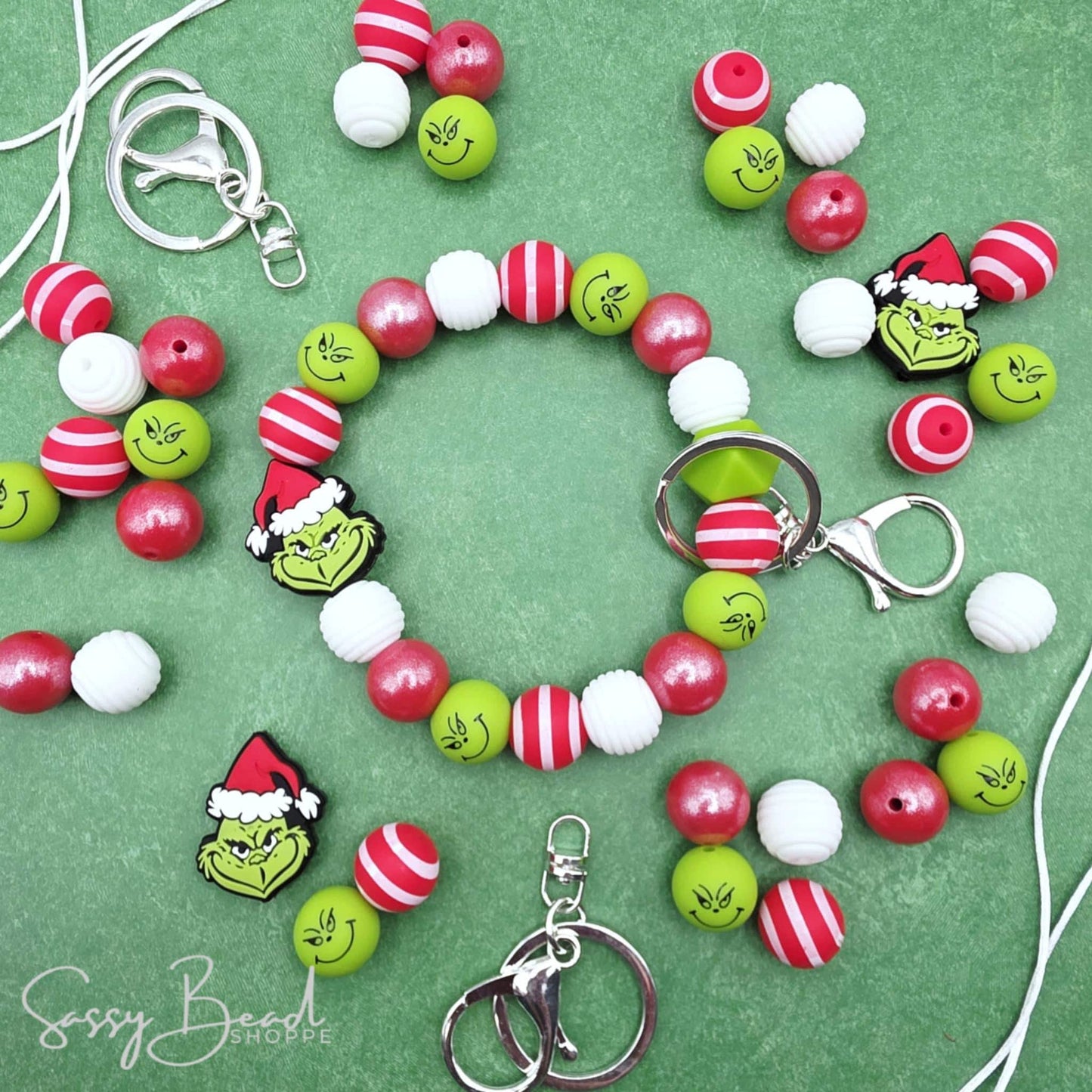 Mean Green Holiday DIY Wristlet with a fun mix of Christmas beads - Green guy focal, red stripe, green guy bead — plus accent beads