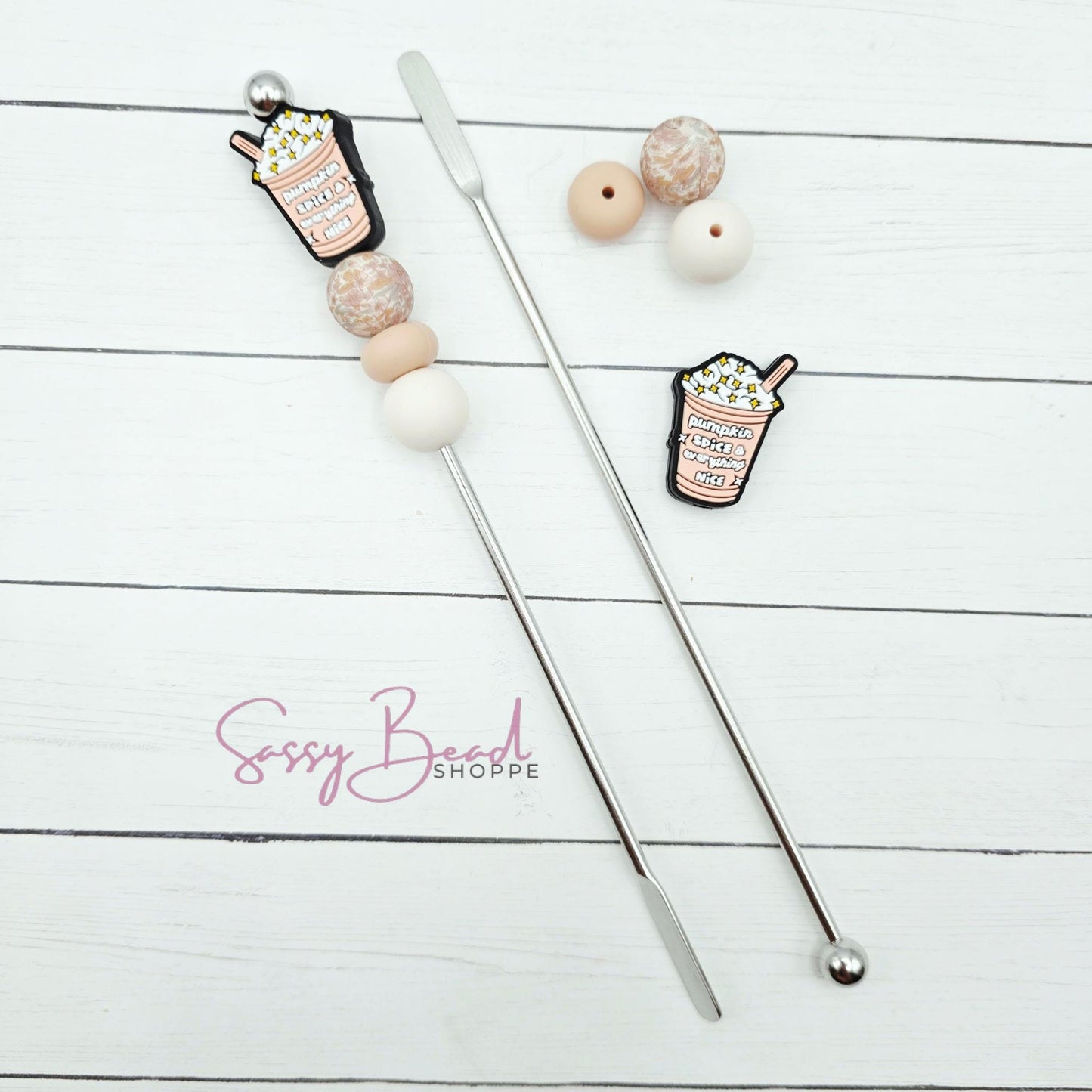 Close-up of Ice Coffee-themed silicone beads in Pumpkin Spice designs for DIY stir stick making