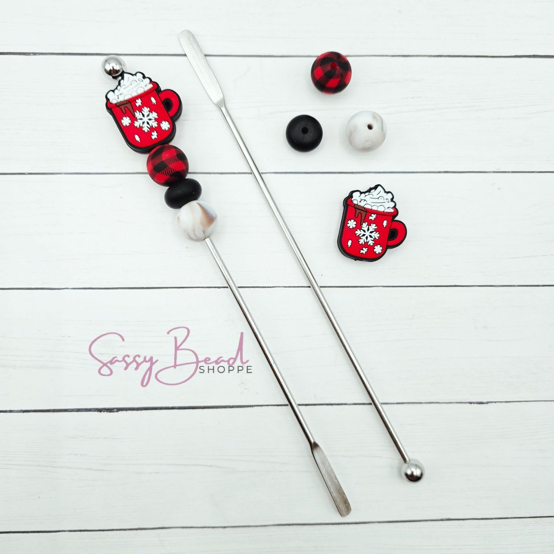 Close-up of Winter-themed silicone beads in Snowflake Coffee designs for DIY stir stick making