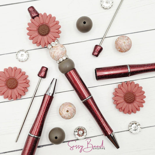 Close-up of flower-themed silicone beads in floral designs for DIY pen making