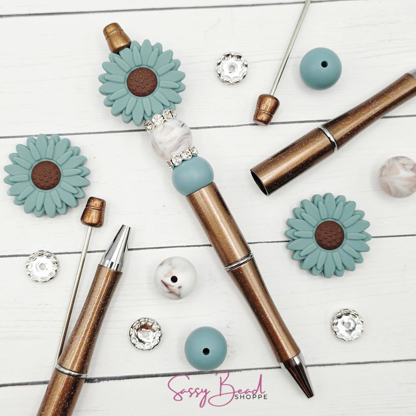 Close-up of flower-themed silicone beads in floral designs for DIY pen making