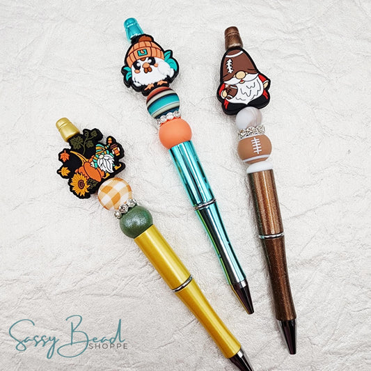 beaded pens, including seasonal turkey and gnome designs